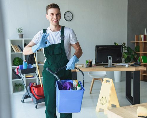 handsome-smiling-young-cleaner-holding-bucket-with-resize.jpg